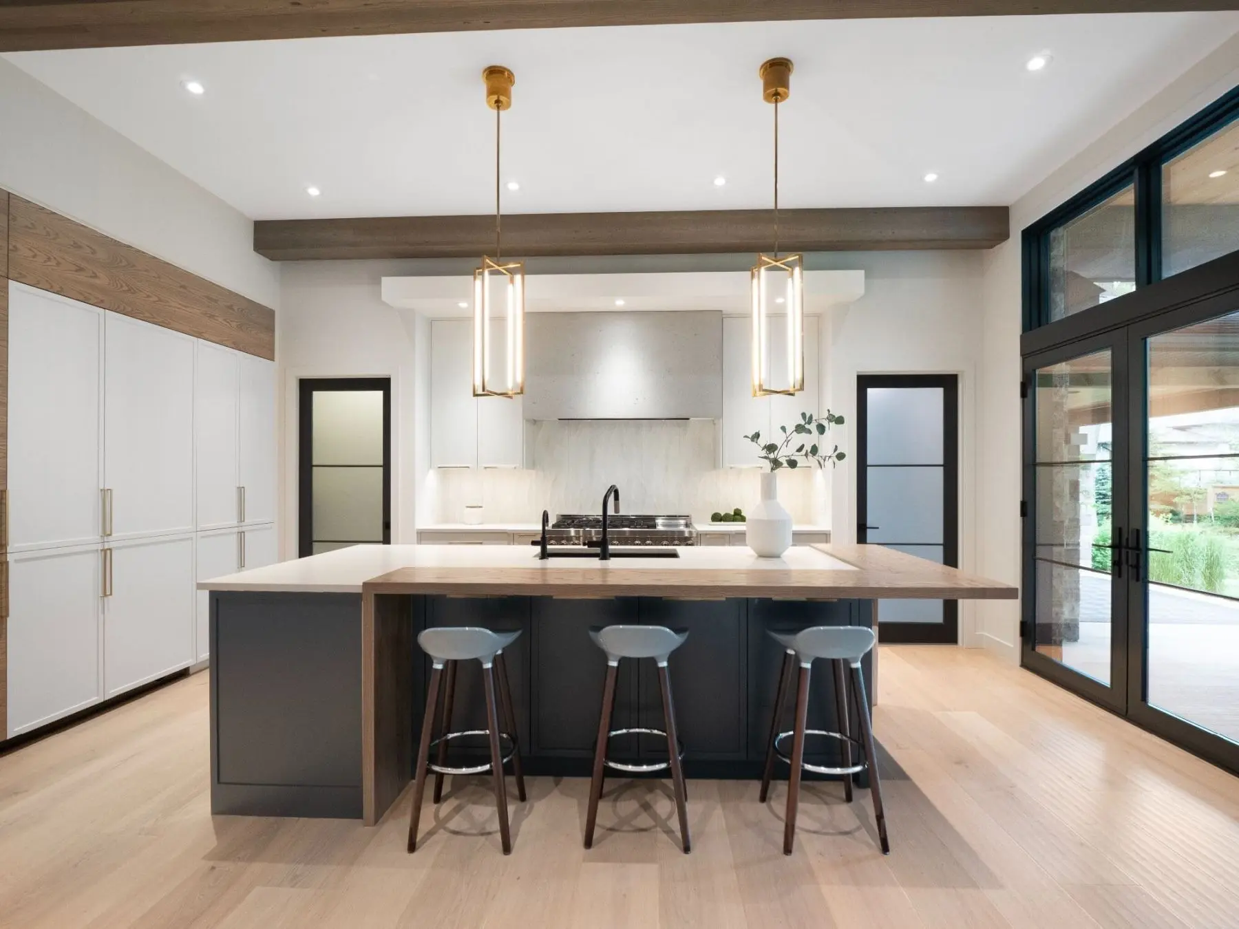 Modern kitchen island with custom cabinetry by Homestead Woodworks, showcasing contemporary design and premium craftsmanship